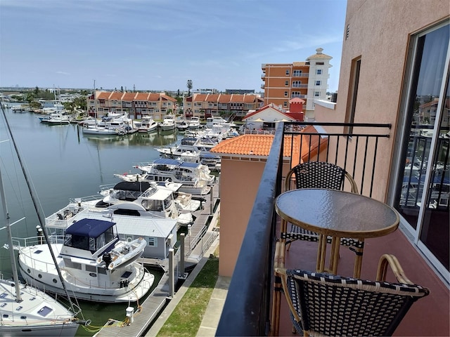 balcony featuring a water view