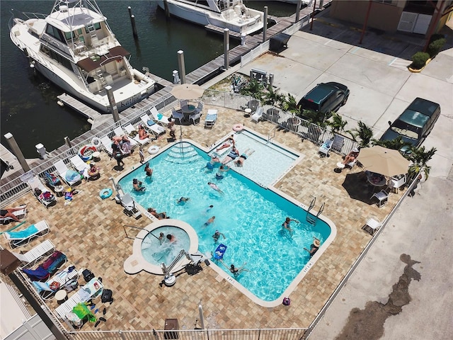 birds eye view of property with a water view