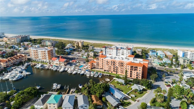aerial view with a view of the beach, a view of city, and a water view