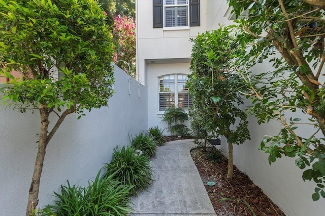 view of side of property featuring stucco siding