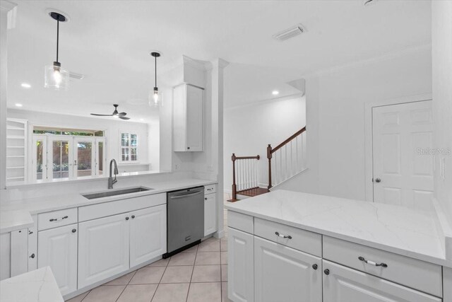 kitchen featuring visible vents, a ceiling fan, white cabinetry, a sink, and dishwasher