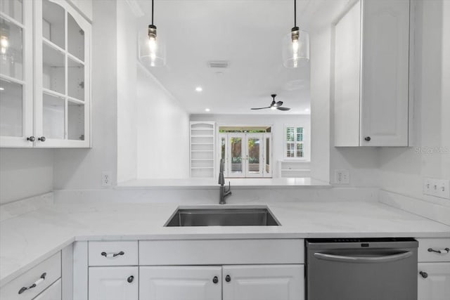 kitchen featuring white cabinets, a sink, dishwasher, a ceiling fan, and glass insert cabinets