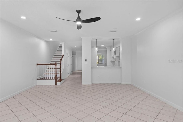 unfurnished living room with a ceiling fan, baseboards, recessed lighting, and stairway