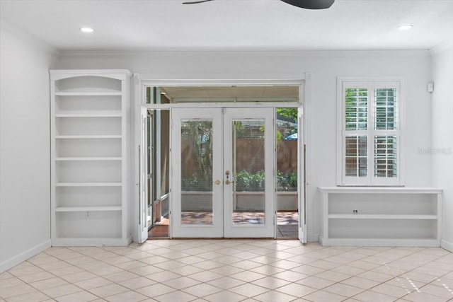 entryway featuring french doors, crown molding, baseboards, recessed lighting, and light tile patterned flooring