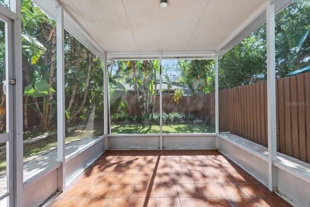 unfurnished sunroom with plenty of natural light