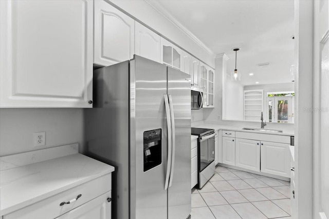 202 S Lincoln Ave, Tampa, FL 33609 - kitchen featuring appliances with stainless steel finishes, glass insert cabinets, white cabinets, light tile patterned floors, and crown molding