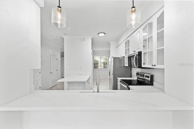 202 S Lincoln Ave, Tampa, FL 33609 - kitchen with stainless steel appliances, glass insert cabinets, white cabinets, light stone counters, and a peninsula