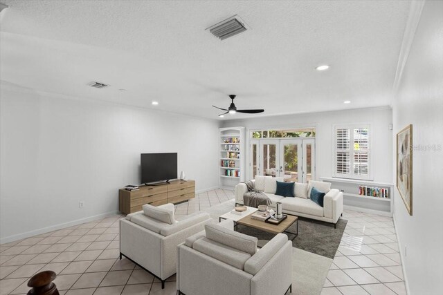 202 S Lincoln Ave, Tampa, FL 33609 - living area with light tile patterned floors, ceiling fan, recessed lighting, french doors, and a textured ceiling