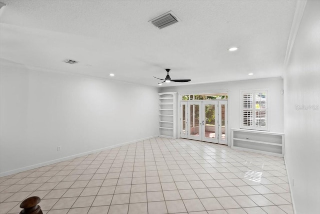 202 S Lincoln Ave, Tampa, FL 33609 - unfurnished room with ceiling fan, french doors, recessed lighting, a textured ceiling, and built in shelves