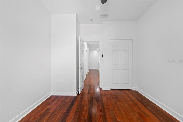 202 S Lincoln Ave, Tampa, FL 33609 - unfurnished bedroom with wood finished floors, a closet, and ceiling fan