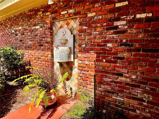 exterior details featuring brick siding