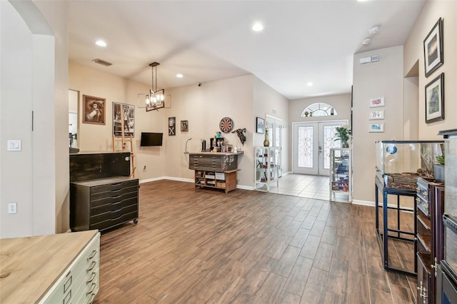 1939 Heartland Cir, Valrico, FL 33594 - entryway featuring french doors, visible vents, dark wood finished floors, baseboards, and recessed lighting