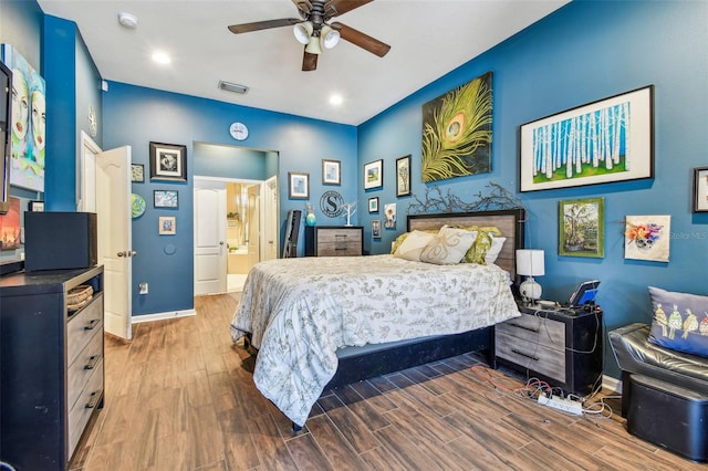1939 Heartland Cir, Valrico, FL 33594 - bedroom with baseboards, recessed lighting, wood finished floors, and visible vents