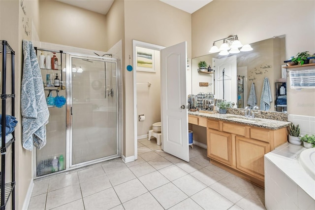1939 Heartland Cir, Valrico, FL 33594 - full bath with vanity, a garden tub, toilet, tile patterned floors, and a stall shower