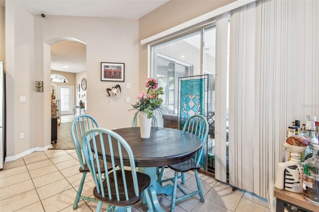 1939 Heartland Cir, Valrico, FL 33594 - dining area with arched walkways and light tile patterned floors