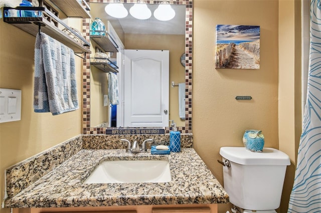 1939 Heartland Cir, Valrico, FL 33594 - bathroom featuring vanity, a textured wall, and toilet