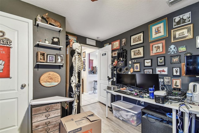 1939 Heartland Cir, Valrico, FL 33594 - office area with a textured ceiling, wood finished floors, and visible vents