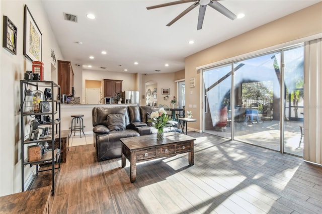 1939 Heartland Cir, Valrico, FL 33594 - living room featuring ceiling fan, recessed lighting, wood finished floors, and visible vents