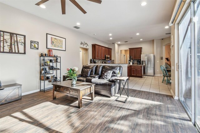 1939 Heartland Cir, Valrico, FL 33594 - living area with visible vents, baseboards, light wood-style floors, recessed lighting, and a ceiling fan