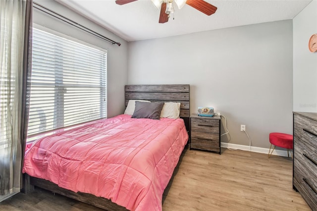 1939 Heartland Cir, Valrico, FL 33594 - bedroom featuring baseboards, ceiling fan, and wood finished floors