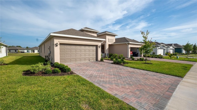 5735 Mezzana Run, Palmetto, FL 34221 - view of front of home featuring stucco siding, decorative driveway, a front yard, and a garage