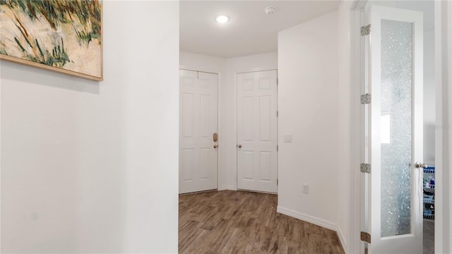 5735 Mezzana Run, Palmetto, FL 34221 - hallway featuring baseboards, wood finished floors, and recessed lighting