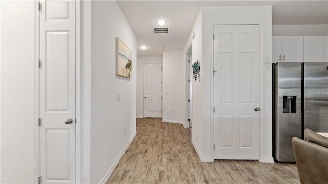 5735 Mezzana Run, Palmetto, FL 34221 - corridor featuring recessed lighting, light wood-type flooring, visible vents, and baseboards