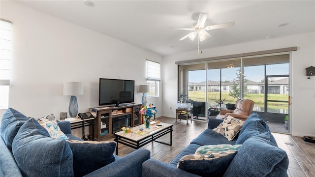 5735 Mezzana Run, Palmetto, FL 34221 - living area with a ceiling fan, wood finished floors, and a wealth of natural light