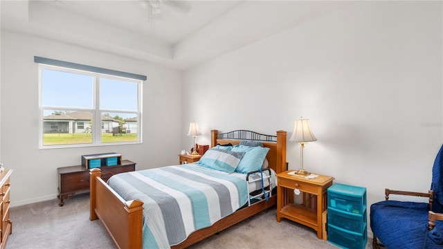 5735 Mezzana Run, Palmetto, FL 34221 - carpeted bedroom with baseboards, a ceiling fan, and a raised ceiling