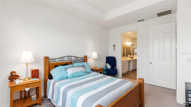5735 Mezzana Run, Palmetto, FL 34221 - bedroom featuring ensuite bath, carpet floors, visible vents, and baseboards