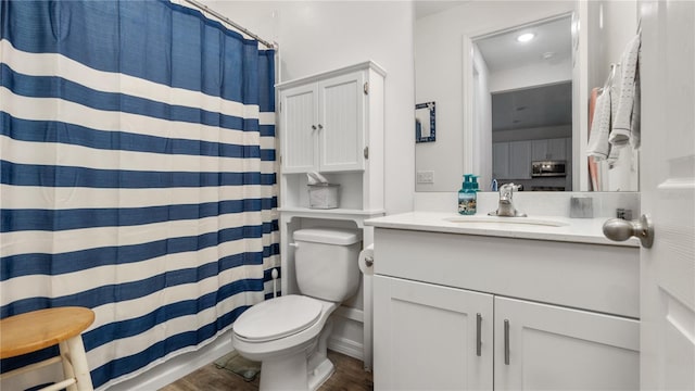 5735 Mezzana Run, Palmetto, FL 34221 - bathroom featuring a shower with shower curtain, wood finished floors, toilet, and vanity
