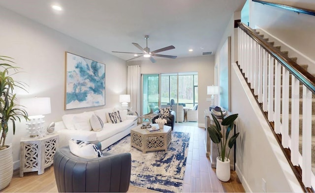 living room featuring recessed lighting, stairway, visible vents, a ceiling fan, and light wood-type flooring