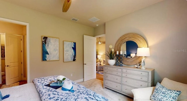 bedroom featuring ceiling fan, baseboards, visible vents, and light carpet