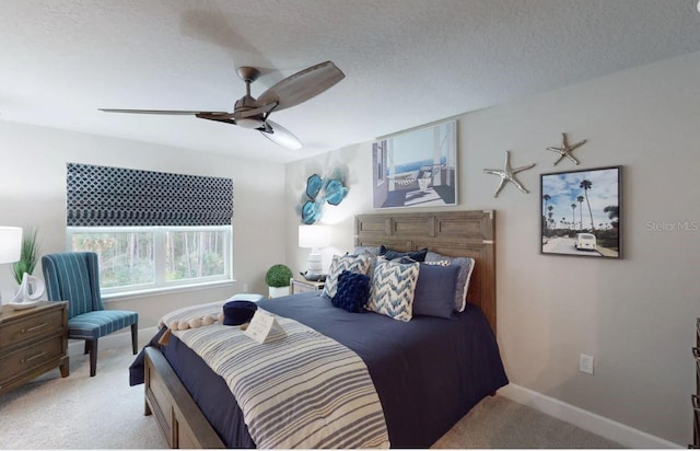 bedroom featuring ceiling fan, baseboards, and carpet flooring