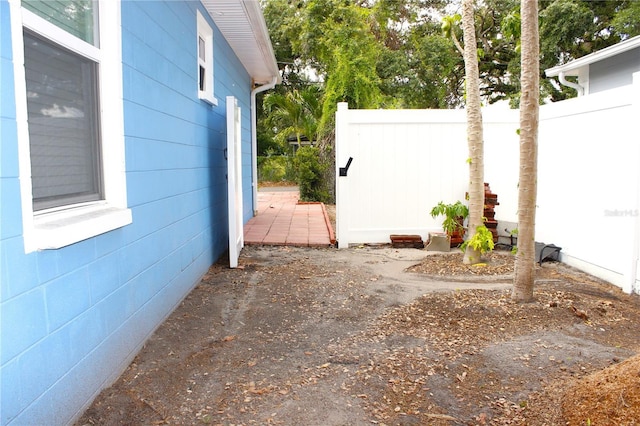view of side of property featuring fence