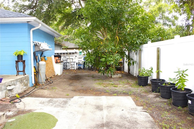 view of yard featuring a fenced backyard and a patio area