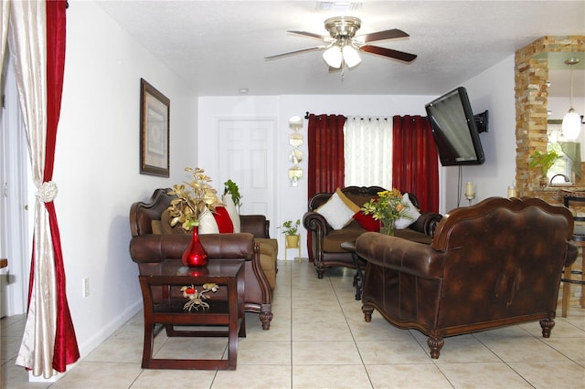 living room with light tile patterned floors and ceiling fan