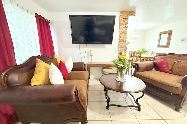 living room featuring an inviting chandelier and tile patterned floors