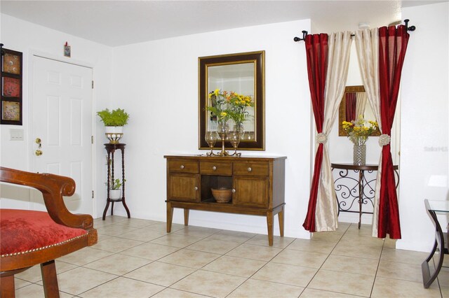 3306 E Chelsea St, Tampa, FL 33610 - living area featuring light tile patterned floors
