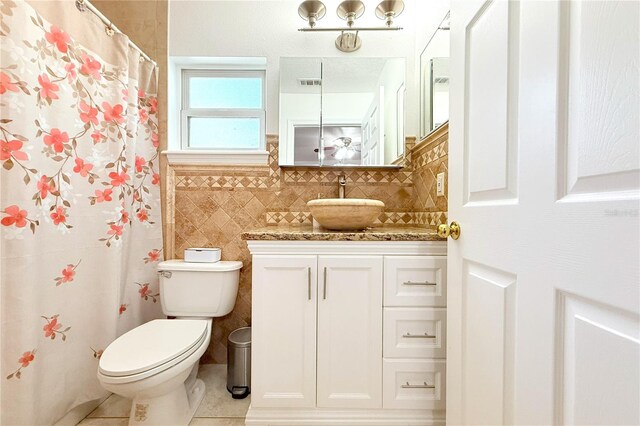 3306 E Chelsea St, Tampa, FL 33610 - full bath featuring visible vents, vanity, toilet, tile walls, and tile patterned floors
