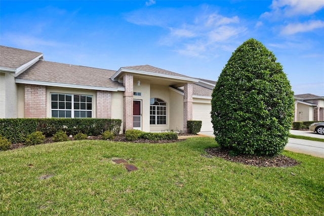 1046 Almondwood Dr, Trinity, FL 34655 - view of front of house featuring a front lawn, a shingled roof, brick siding, and a garage