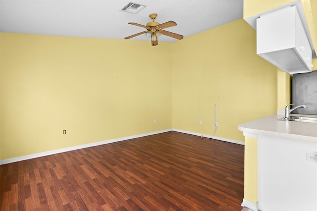 1046 Almondwood Dr, Trinity, FL 34655 - unfurnished living room featuring dark wood-style flooring, a sink, baseboards, visible vents, and a ceiling fan