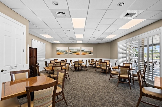 1046 Almondwood Dr, Trinity, FL 34655 - carpeted dining area with visible vents and a paneled ceiling