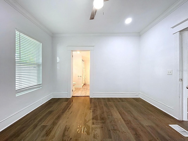 unfurnished room featuring wood finished floors, visible vents, ceiling fan, and ornamental molding