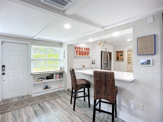 4231 8th St N, Saint Petersburg, FL 33703 - dining area with recessed lighting, light wood-style floors, visible vents, and a textured wall