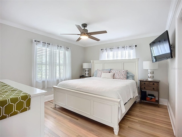 4231 8th St N, Saint Petersburg, FL 33703 - bedroom with a ceiling fan, ornamental molding, and light wood-type flooring