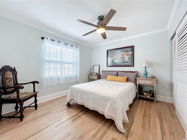 4231 8th St N, Saint Petersburg, FL 33703 - bedroom featuring a ceiling fan, a closet, baseboards, light wood finished floors, and crown molding