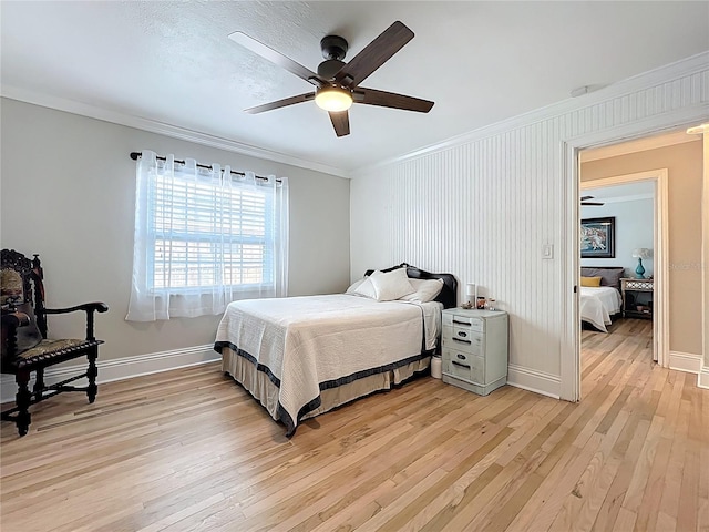 4231 8th St N, Saint Petersburg, FL 33703 - bedroom featuring baseboards, ceiling fan, light wood-style floors, and crown molding