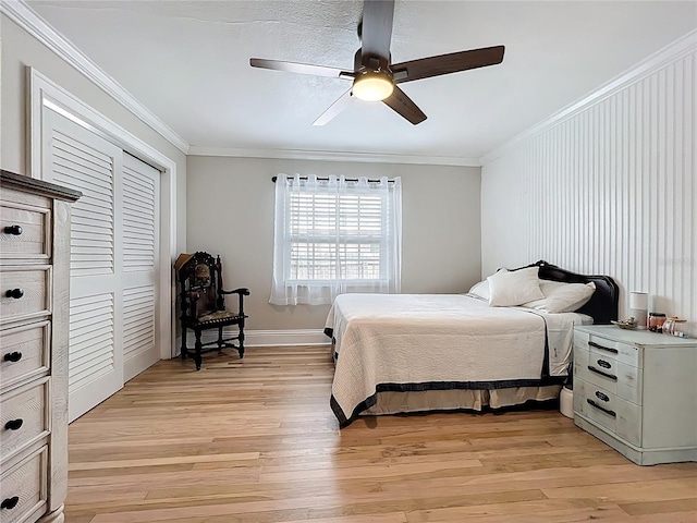 4231 8th St N, Saint Petersburg, FL 33703 - bedroom with ornamental molding, a closet, and light wood-style flooring