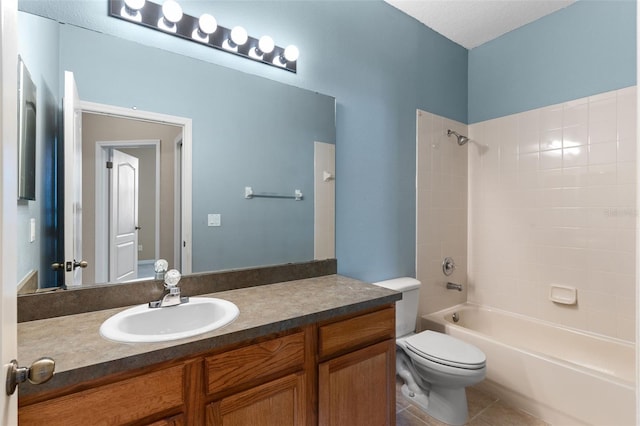 full bathroom featuring toilet, tile patterned floors, tub / shower combination, and vanity